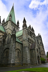 Fototapeta premium Nidaros cathedral in Trondheim with dramatic sky 