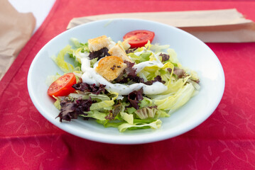 Italian salad on a white plate.