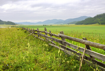 Fototapeta na wymiar Pasture fence in the Altai Mountains