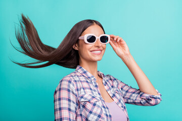 Profile photo of impressed millennial brunette lady wear eyewear purple shirt isolated on aquamarine color background
