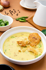 Nasi Soto Ayam or Soto Medan is  Traditional chicken soup with rice from Medan, North Sumatra. 

Soto is a traditional Indonesian soup mainly composed of broth, meat, fried patties and vegetables.