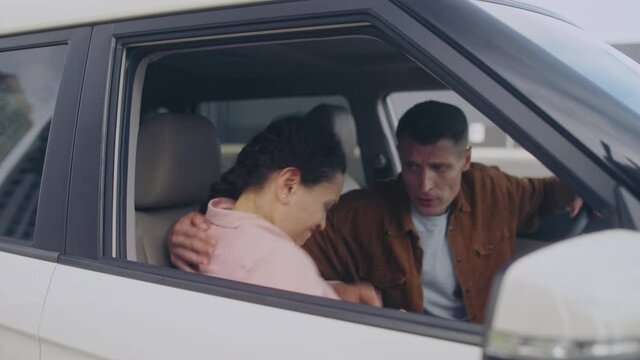 Upset wife rejecting apologizing husband, getting out of the car, separation