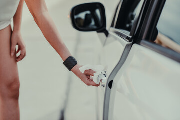 woman hand cleaning on car door handle, outside car against Novel coronavirus or Corona Virus Disease (Covid-19). Antiseptic, Hygiene and Healthcare concept