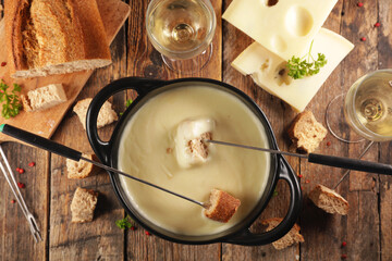 cheese fondue with bread and wine