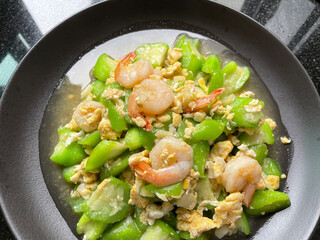 This is Thai food .The menu is stir - fried Zucchini with Eggs and Shrimps.