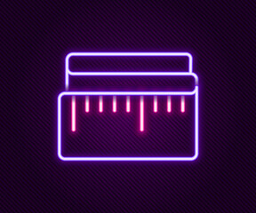 Glowing neon line Tape measure icon isolated on black background. Measuring tape. Colorful outline concept. Vector