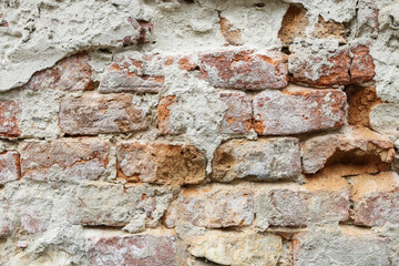 Abstract background: a composition of brick, plaster and cement.