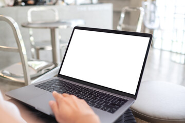 Mockup image of a woman using and touching on laptop touchpad with blank white desktop screen