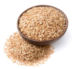 uncooked wheat bran in the wooden bowl, isolated on the white background