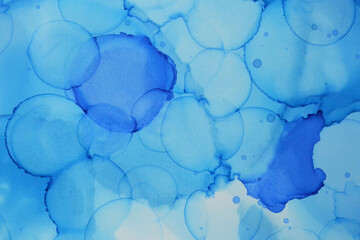 Fototapeta na wymiar Blue polka dot texture drawn with alcohol ink