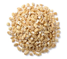 uncooked steel cut oats isolated on the white background, top view