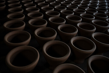 Fototapeta premium Clay used to mold to be a container lined up before being put into the pottery kiln.