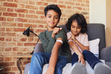 Two brothers with plasters on their arms 