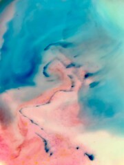 pink and blue marbled background swirl of ink fade and gradient of ink and dye 