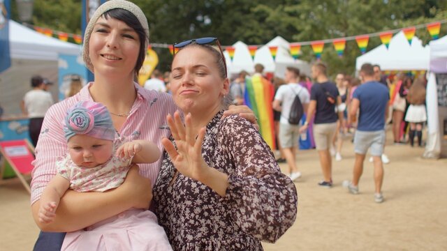 Close communication at leisure. Parenting. Mom with a child hugs her partner. Parent adjustment over time in lesbian families adopting from foster care.