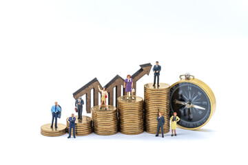 Business, Money and Planning concept. Group of businessman and businesswoman miniature figure...