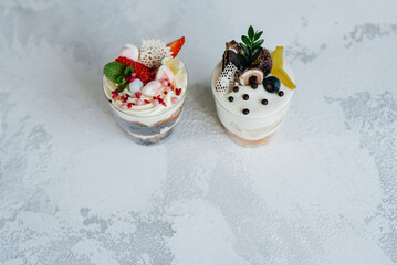 Two beautiful and delicious trifle cakes close-up on a light background. Dessert, healthy food