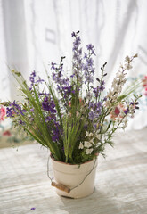 Fototapeta na wymiar Still life with fresh wild flowers in vase