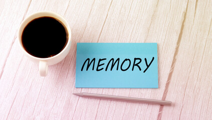 MEMORY text on blue sticker with cofee and pen