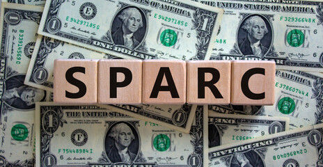 SPARC, special purpose acquisition rights company symbol. Cubes with words 'SPARC' on beautiful dollar background, copy space. Business and SPARC, special purpose acquisition rights company concept.