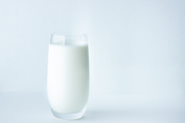 Close up of a glass of milk isolated on white background with copy space