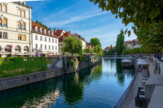 Footbridge Ribja brv over Ljubljanica river with river bank