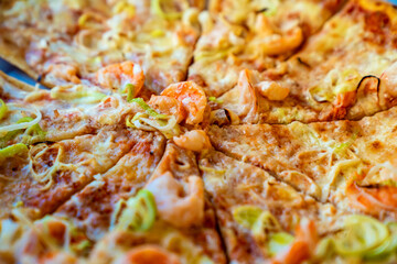 pizza with cheese and seafood. traditional Italian pastries.