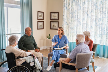 Nurse talking to senior people during group therapy - Powered by Adobe
