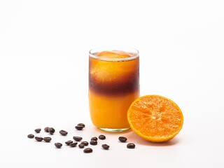 orange coffee with a piece of orange and coffee bean decoration. Healthy and caffeine drink for the morning.