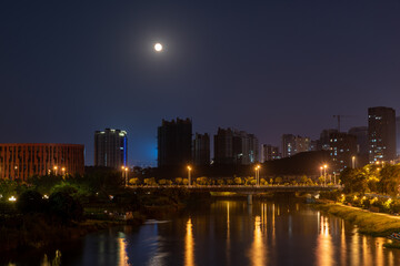Fototapeta na wymiar A city at night, a colorful city where rivers flow