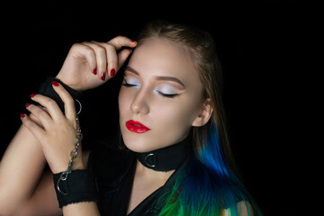 New creative make-up, conceptual art idea. White shadows, vivid colors graphic shapes lines, cosmetics, necklace choker. close-up skincare and hands care. perfect straight colorful hair. handcuffs
