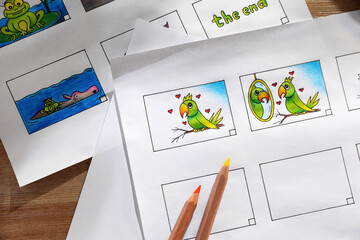 Storyboards with cartoon sketches at workplace, flat lay. Pre-production process
