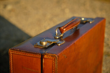 an old vintage suitcase on the ground