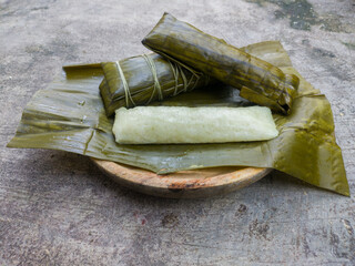 rice mixed with coconut milk wrapped in banana leaves and steamed, a typical Indonesian street food, often served during Eid, in Indonesian it is called "Buras"