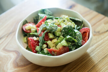 Healthy vegetable salad with yogurt dressing