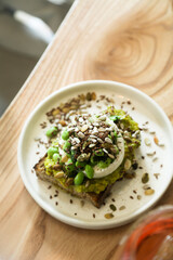 Healthy avocado toast with cheese and seeds