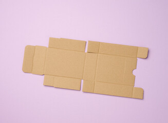 protective paper from under a box with a perfume, template from white corrugated cardboard, purple background,