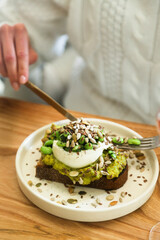 Healthy avocado toast with cheese and seeds