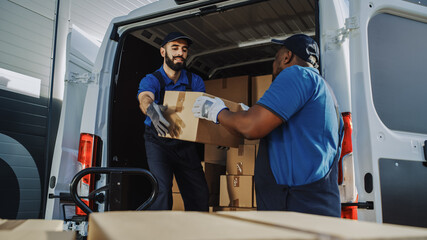 Logistics Warehouse Two Happy Workers Talk, Joke use Hand Pallet Truck Start Loading Delivery Truck with Cardboard Boxes, Online Orders, Purchases, E-Commerce Goods. - obrazy, fototapety, plakaty