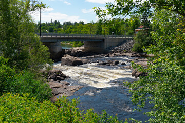 river passing under the bridge-