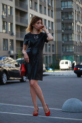 Fototapeta premium Slender woman walking in the street