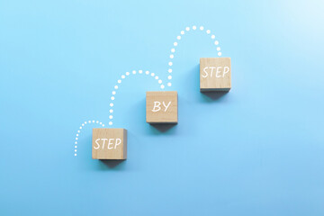 step by step letters on wooden cube