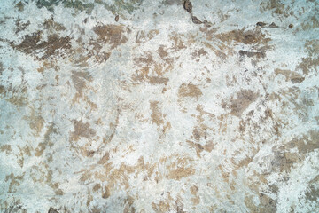 Old shabby concrete wall with swirls on it