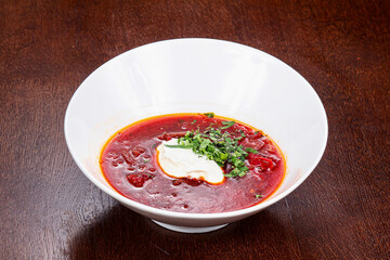 Russian traditional borsch soup with sour cream