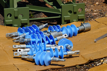 Catenary mast and insulators ready for installation.