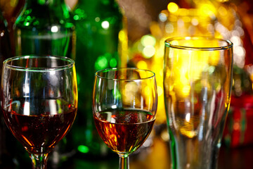glass of alcohol and bottle of beer in the new year party