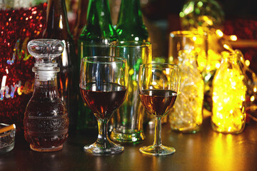 glass of alcohol and bottle of beer in the new year party