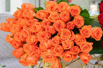 Bouquet of orange roses close up. Background