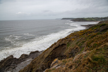 The huge surfing beach of Caswell Bay, on the South Wales Coast Path, at low tide