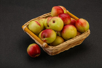 Sweet small nectarines in the basket